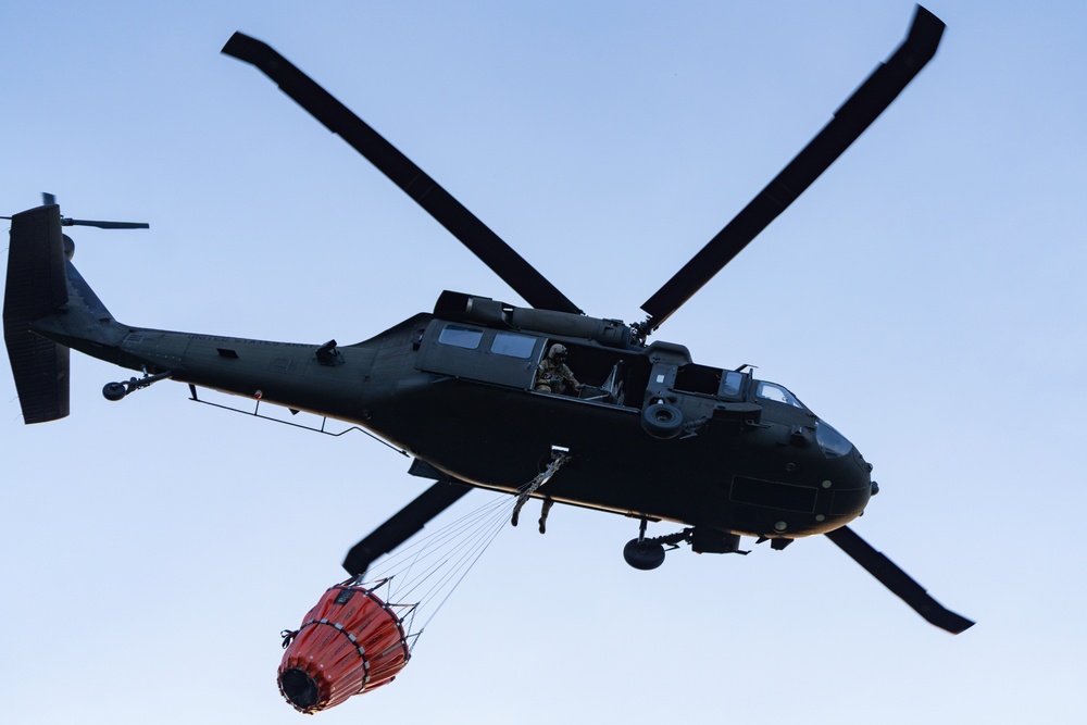 Black Hawks Train for Aerial Firefighting Support During Gunnery Operations