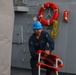 Sailors aboard the USS John Finn conduct a sea and anchor detail in Diego Garcia