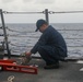 Sailors aboard the USS John Finn conduct a sea and anchor detail in Diego Garcia