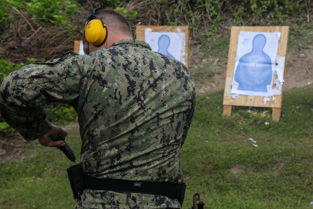 Sailors assigned to the USS John Finn conduct a small arms gun shoot in Diego Garcia