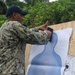 Sailors assigned to the USS John Finn conduct a small arms gun shoot in Diego Garcia