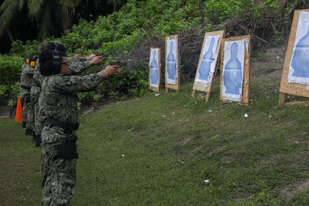 Sailors assigned to the USS John Finn conduct a small arms gun shoot in Diego Garcia