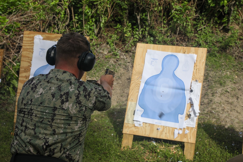 Sailors assigned to the USS John Finn conduct a small arms gun shoot in Diego Garcia