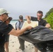 Sailors assigned to the USS John Finn conduct a beach cleanup in Diego Garcia