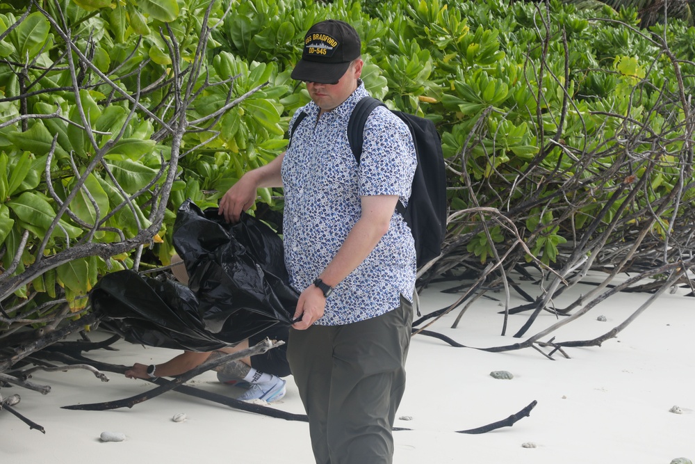 Sailors assigned to the USS John Finn conduct a beach cleanup in Diego Garcia