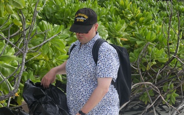 Sailors assigned to the USS John Finn conduct a beach cleanup in Diego Garcia