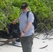 Sailors assigned to the USS John Finn conduct a beach cleanup in Diego Garcia