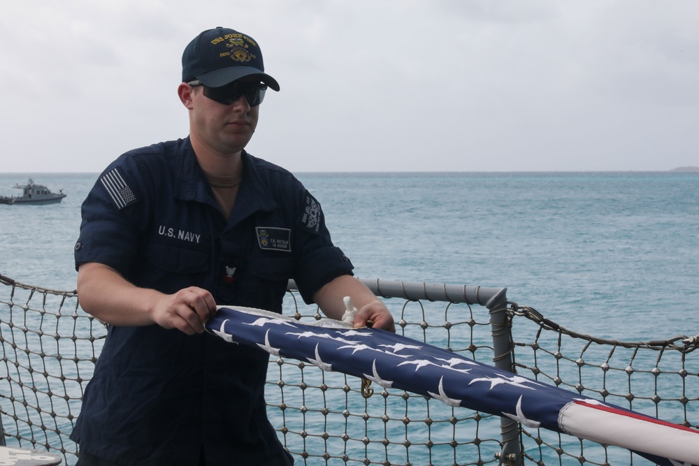 Sailors aboard the USS John Finn conduct a sea and anchor detail in Diego Garcia