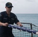 Sailors aboard the USS John Finn conduct a sea and anchor detail in Diego Garcia