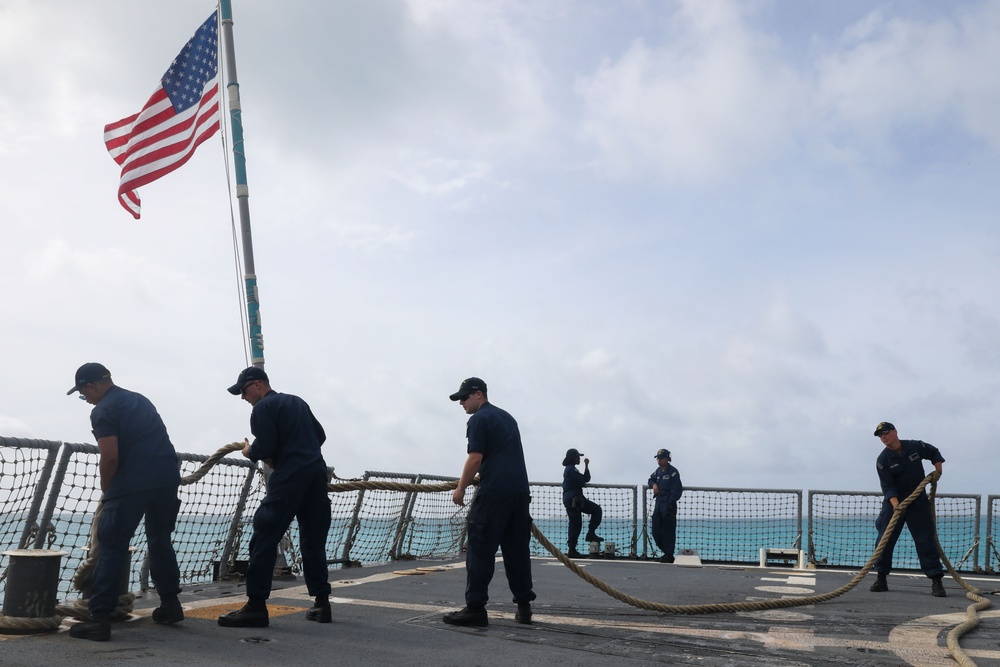 Sailors aboard the USS John Finn conduct a sea and anchor detail in Diego Garcia