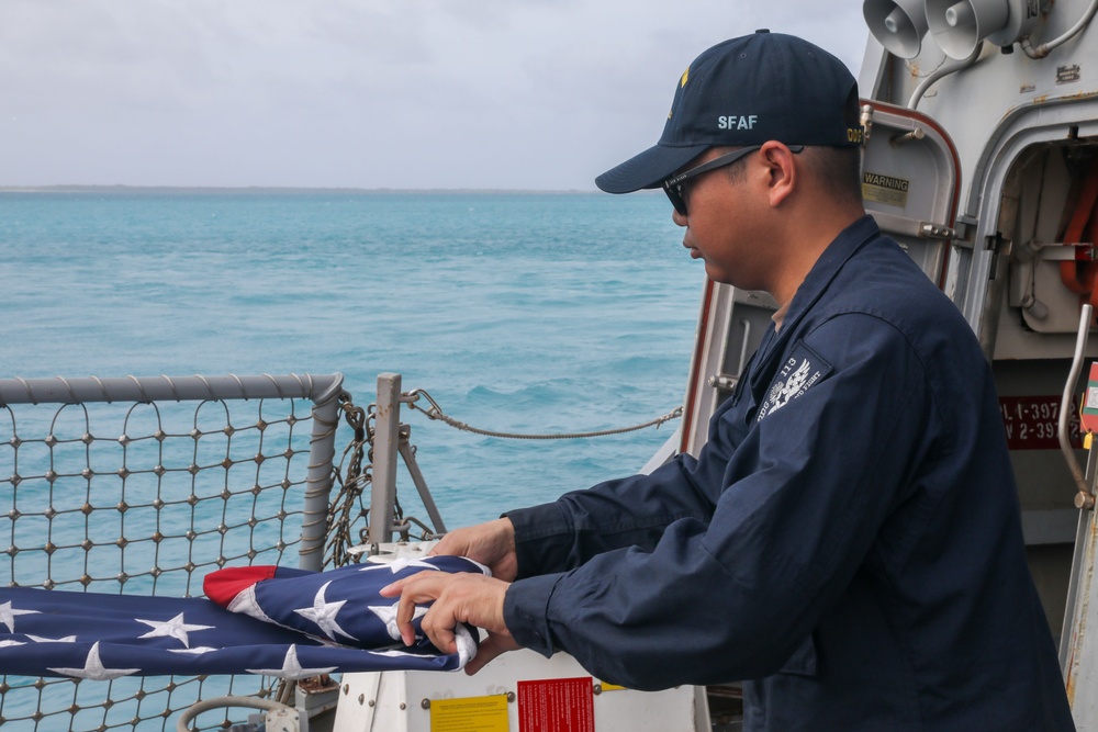 Sailors aboard the USS John Finn conduct a sea and anchor detail in Diego Garcia