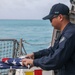 Sailors aboard the USS John Finn conduct a sea and anchor detail in Diego Garcia