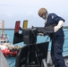 Sailors aboard the USS John Finn conduct a sea and anchor detail in Diego Garcia