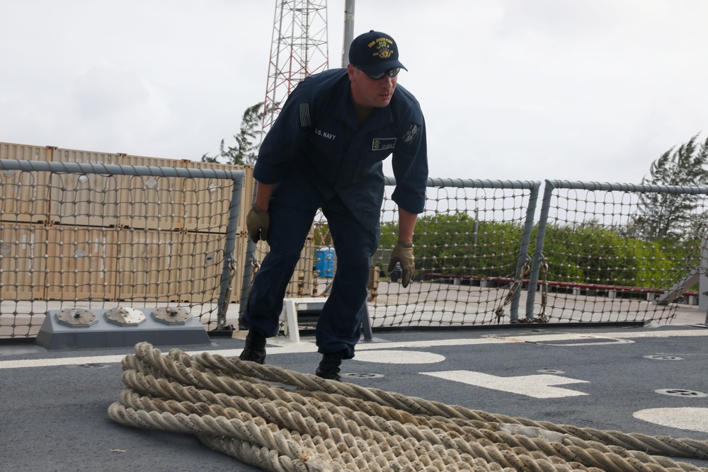 Sailors aboard the USS John Finn conduct a sea and anchor detail in Diego Garcia
