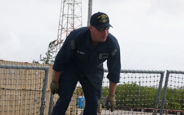 Sailors aboard the USS John Finn conduct a sea and anchor detail in Diego Garcia