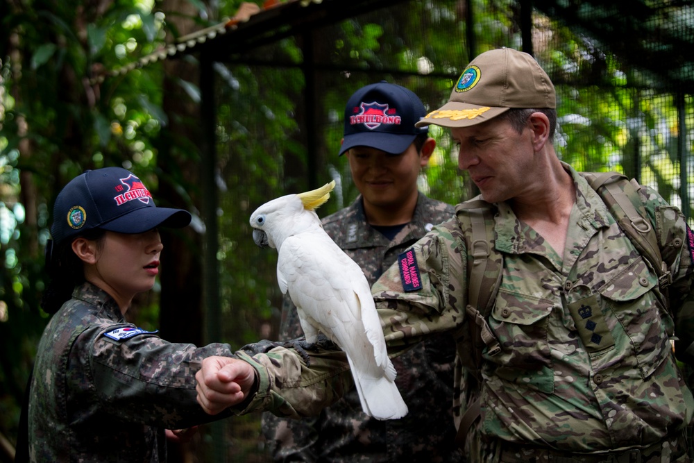 Pacific Partnership 2025 Multinational Servicemembers Discuss Animal Welfare during an engagement at the Rainforest Habitat.