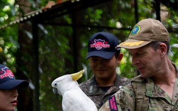 Pacific Partnership 2025 Multinational Servicemembers Discuss Animal Welfare during an engagement at the Rainforest Habitat.
