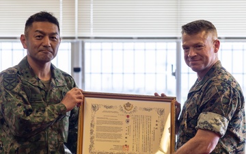 Japan Ground Self-Defense Force presents certificate of appreciation to U.S. Marine Corps 3D Marine Expeditionary Brigade commanding general