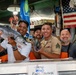 Sailors and Marines tour Pike Place Market during Seattle Fleet Week 2025
