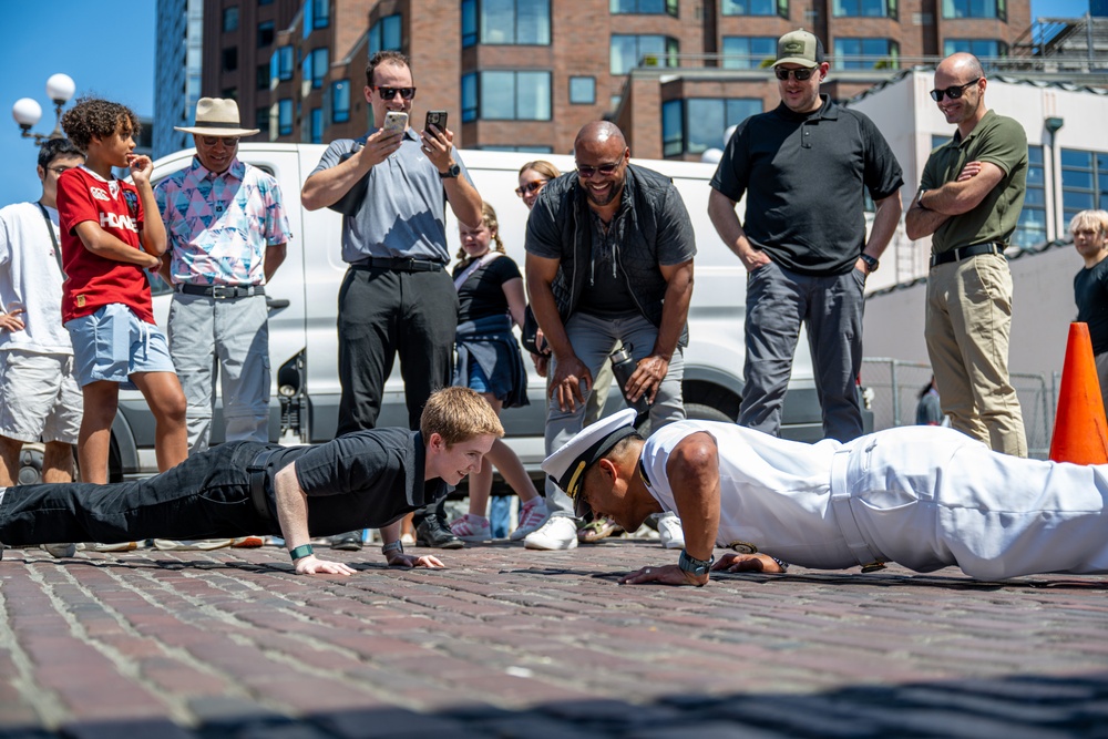 Sailors and Marines tour Pike Place Market during Seattle Fleet Week 2025
