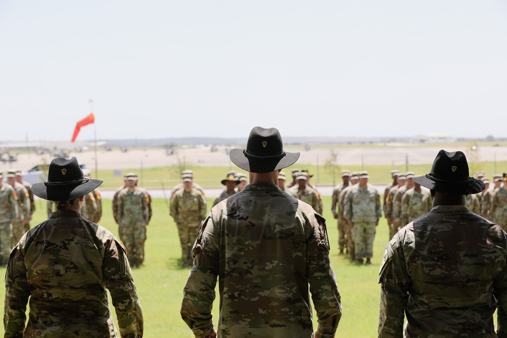 1st Air Cavalry Brigade HHC say farewell to Capt. Jonathan Pompey and welcome incoming commander, Capt. Haley Custer