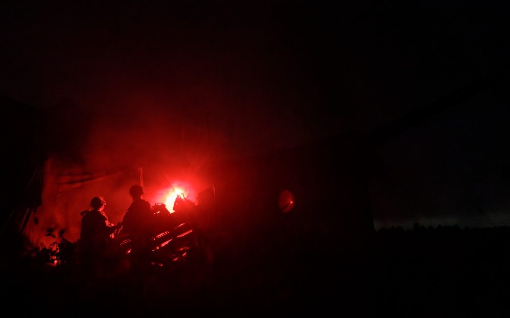 Gun Devils fire artillery at night during Devil Avalanche