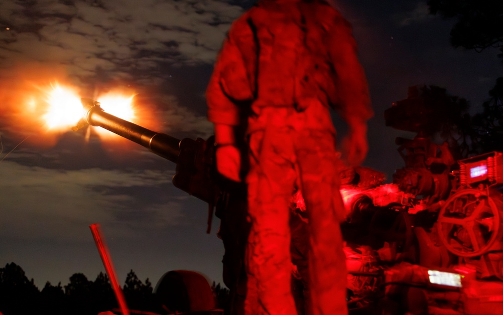Gun Devils fire artillery at night during Devil Avalanche