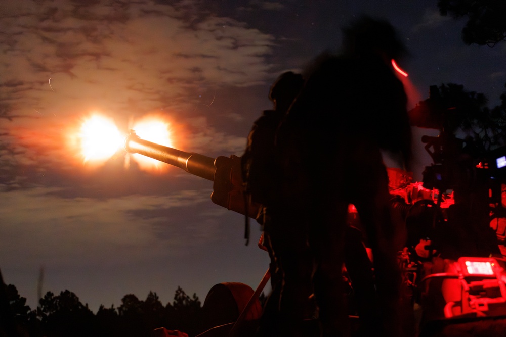 Gun Devils fire artillery at night during Devil Avalanche