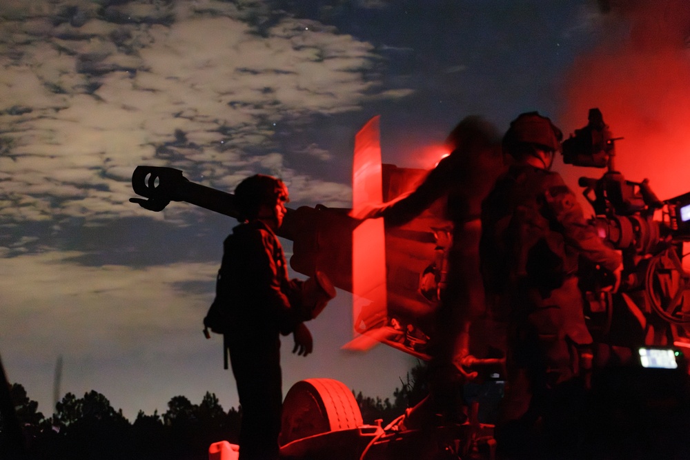 Gun Devils fire artillery at night during Devil Avalanche