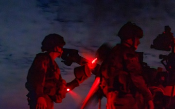 Gun Devils fire artillery at night during Devil Avalanche
