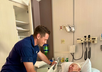 Coast Guardsman reunites with rescued 97-year-old man and his family