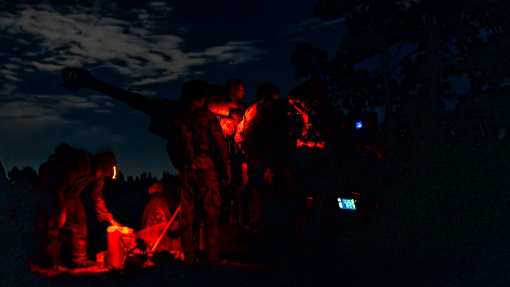 Gun Devils fire M777 155mm howitzer artillery at night during Devil Avalanche