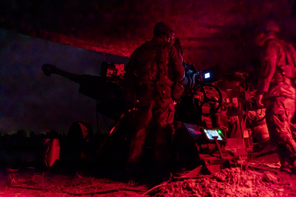 Gun Devils fire M777 155mm howitzer artillery at night during Devil Avalanche