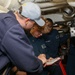 Sailors aboard the USS John Finn conduct an engineering training team drill in the Indian Ocean