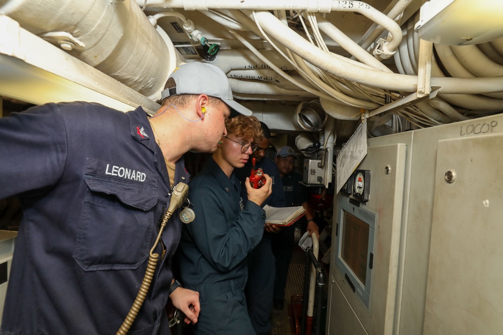 Sailors aboard the USS John Finn conduct an engineering training team drill in the Indian Ocean
