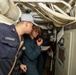 Sailors aboard the USS John Finn conduct an engineering training team drill in the Indian Ocean