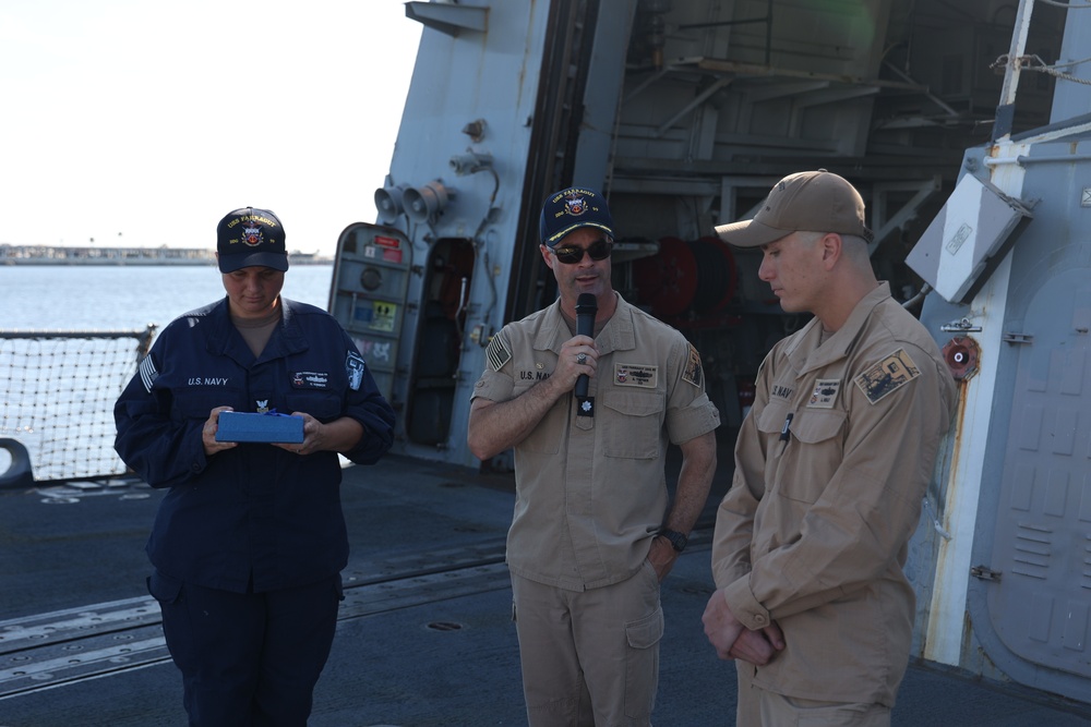 CDR Timpner, Commanding Officer of USS FARRAGUT, Presents Navy and Marine Corps Commendation Medal to LT Reilly