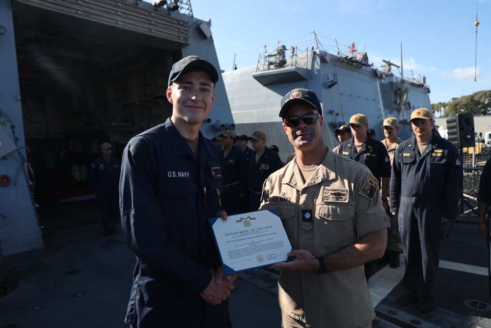 FCA2 Aebischer Receives the Navy and Marine Corps Achievement Medal From CDR Timpner, Commanding Officer of USS FARRAGUT