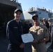 FCA2 Aebischer Receives the Navy and Marine Corps Achievement Medal From CDR Timpner, Commanding Officer of USS FARRAGUT
