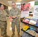 Maj. Bonnie Sgroi, 60th Inpatient Squadron clinical nurse specialist, demonstrates one of the sensory tools to Col. Patrick Parsons