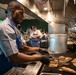 Navy and Coast Guard culinary specialists take a cooking lesson during Seattle Fleet Week 2025