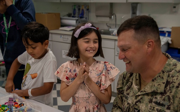 Two Sailors and a Marine visit the Seattle Children’s Hospital