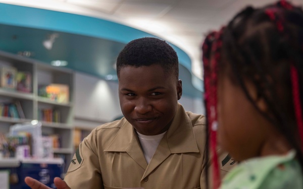 wo Sailors and a Marine visit the Seattle Children’s Hospital