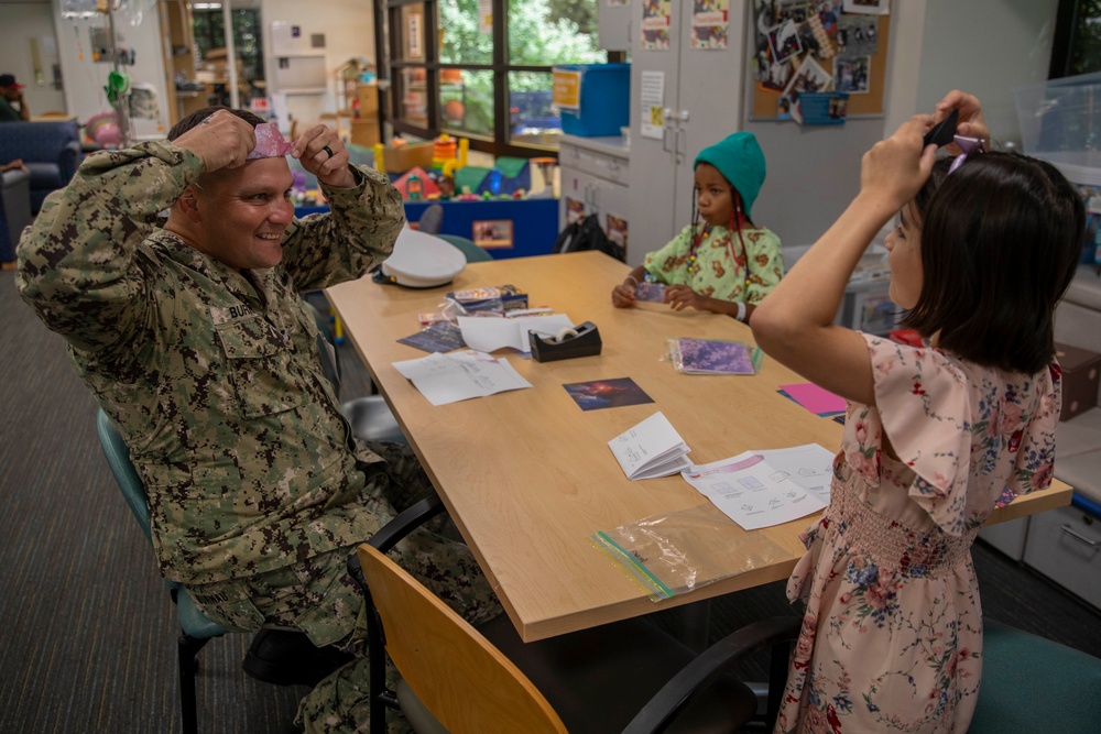 Two Sailors and a Marine visit the Seattle Children’s Hospital