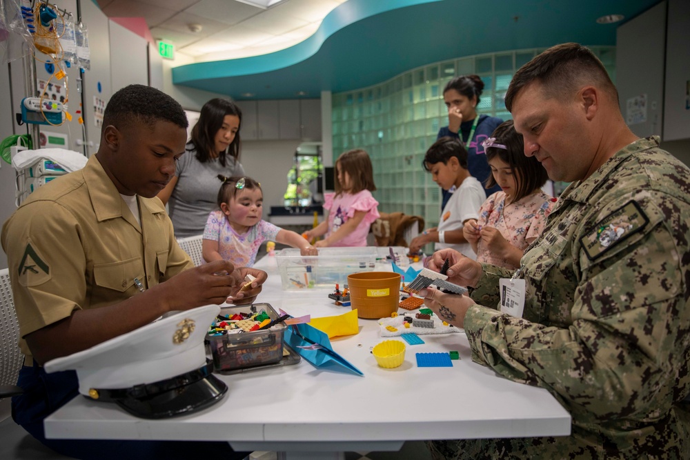 Two Sailors and a Marine visit the Seattle Children’s Hospital