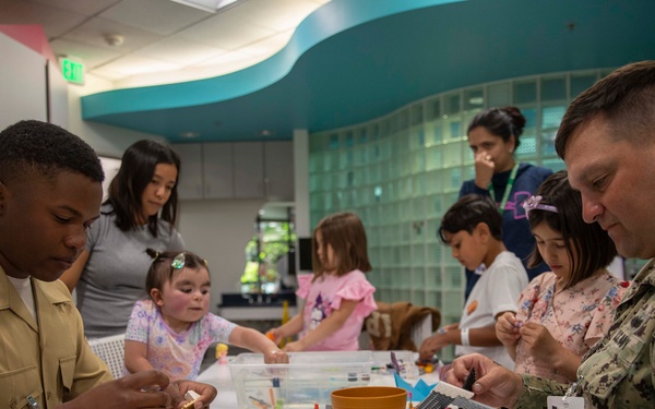 Two Sailors and a Marine visit the Seattle Children’s Hospital