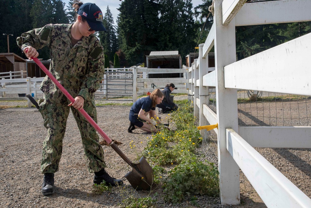 Sailors and Marines volunteer at the Little Bit Therapeutic horse-riding center