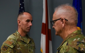 Chaplain Guiffreda is presented with the Air and Space Achievement Medal