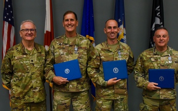 117 ARW Religious Affairs is presented with the Air and Space Achievement Medal
