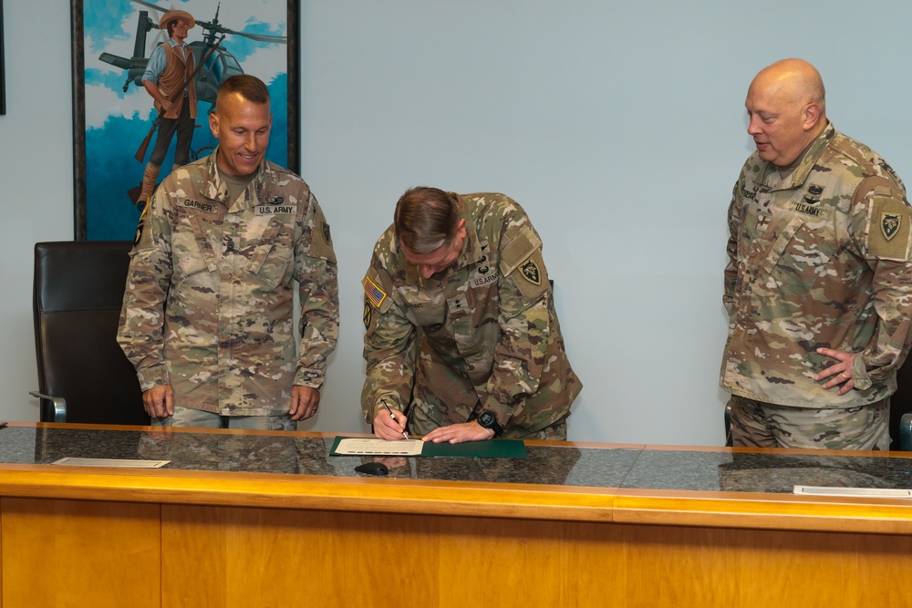 Maj. Gen Todd Hunt signs the Suicide Prevention Awareness Proclamation
